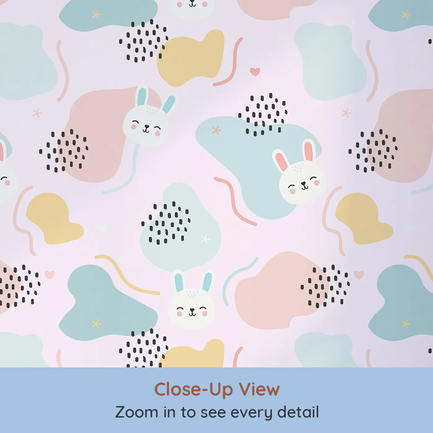 Close-up view of Whimsy Tots' Bunny Bounce Abstract Wallpaper in Blush Pink (W3443A).Smiling rabbits and playful shapes hop across a dreamy pink sky.