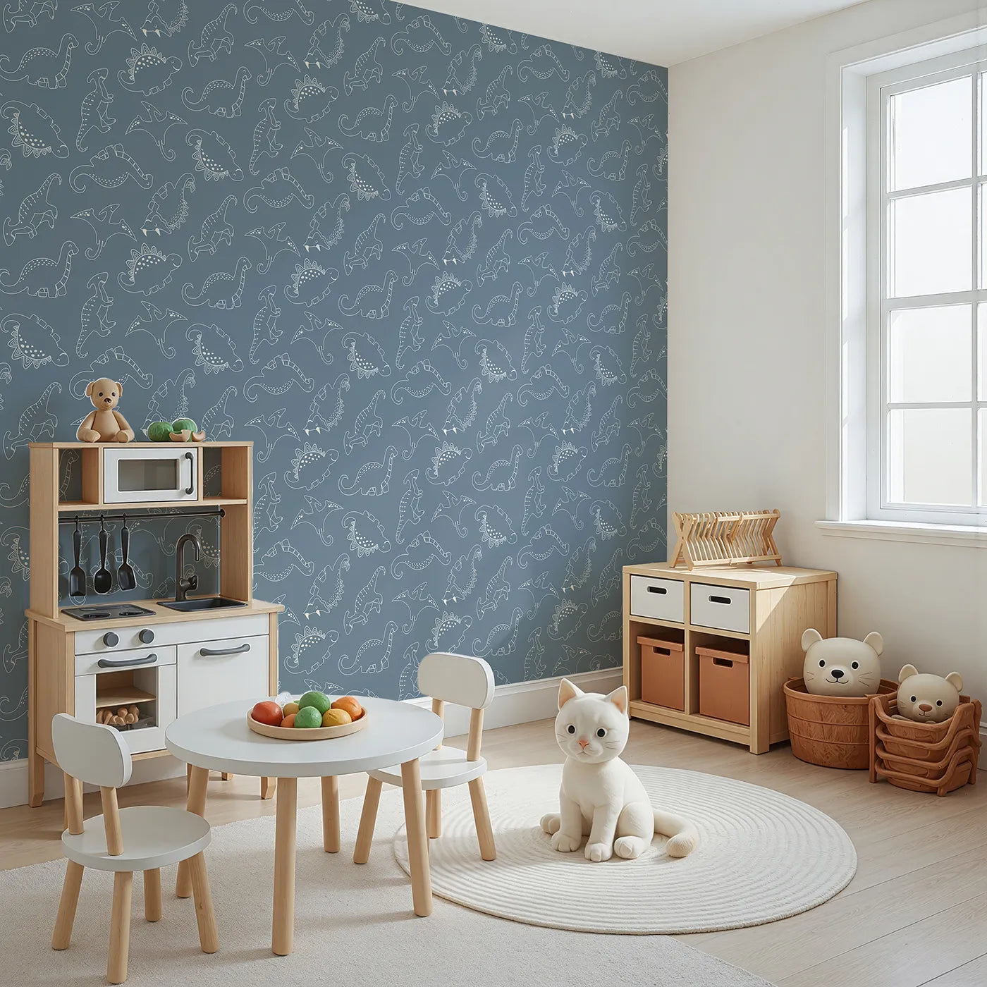 Angled view of Whimsy Tots' Dino Scribble Parade Wallpaper in Denim (W3466A).Happy dinos march playfully across a soft denim blue backdrop.