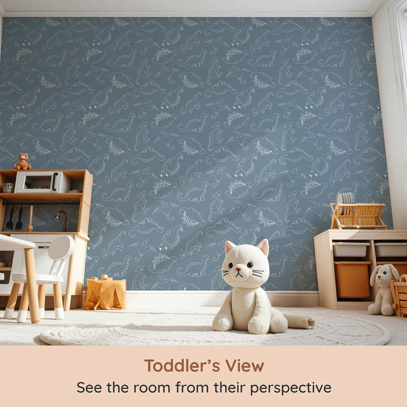 Whimsy Tots Dino Scribble Parade Wallpaper in Denim (W3466A) from your child's view.Happy dinos march playfully across a soft denim blue backdrop.