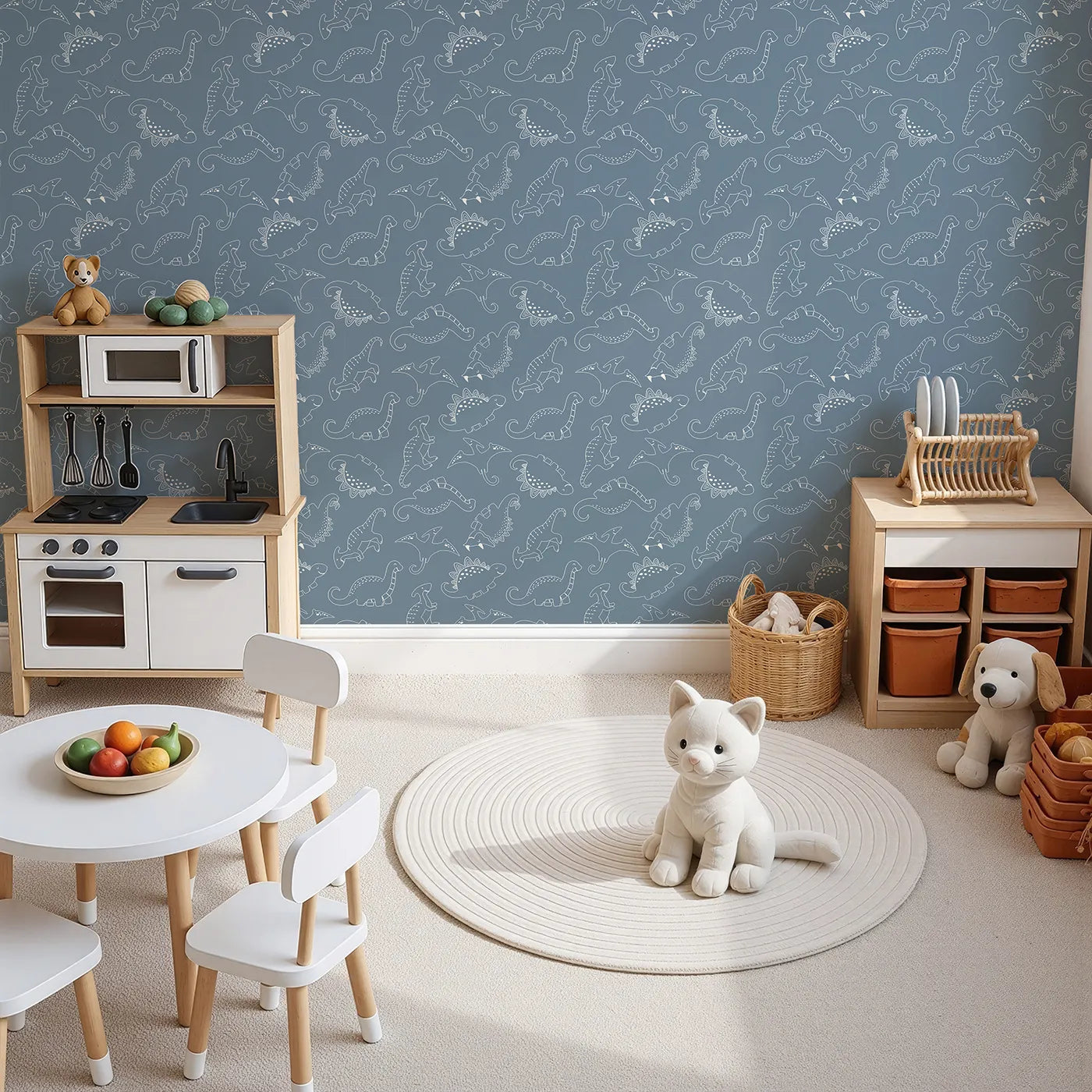 Top-Down view of Whimsy Tots' Dino Scribble Parade Wallpaper in Denim (W3466A).Happy dinos march playfully across a soft denim blue backdrop.