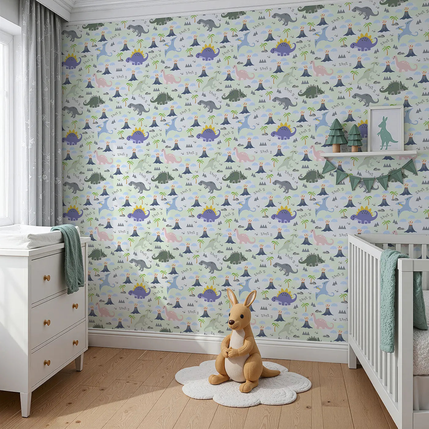 Angled view of Whimsy Tots' Rawr-some Dino Land Wallpaper in Mint Green (W3474B).Smiling dinos roam through minty hills, erupting volcanoes, and playful skies.