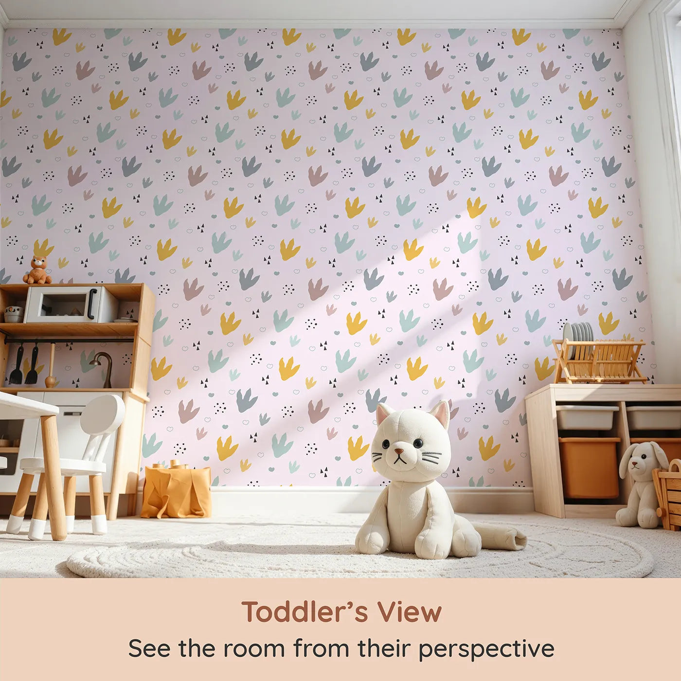 Whimsy Tots Dino Stomp Parade Wallpaper in Blush Pink (W3495B) from your child's view.Colorful dinosaur prints pop against a blush pink trail.