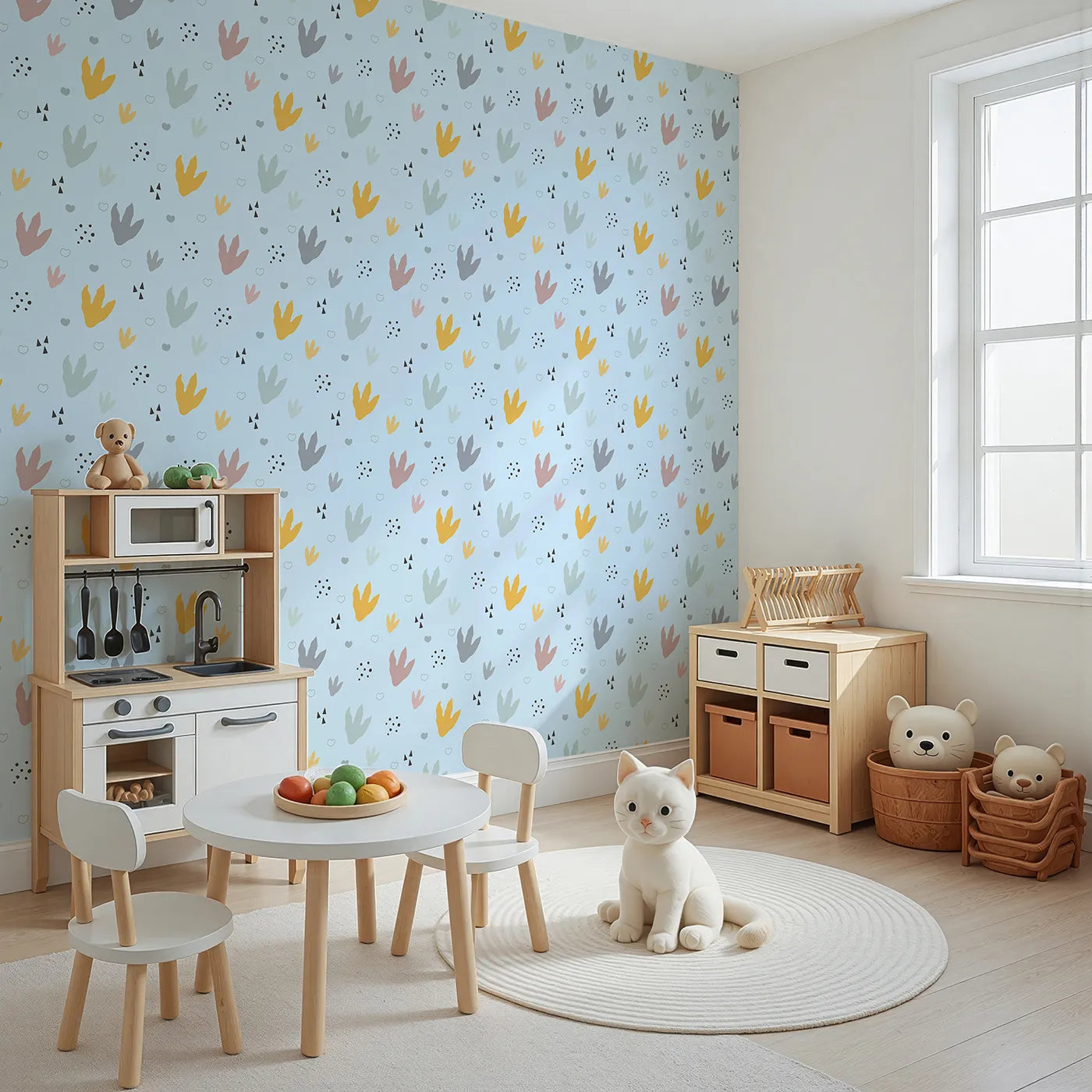 Angled view of Whimsy Tots' Dino Stomp Parade Wallpaper in Sky Blue (W3495E).Colorful dinosaur tracks pop against a cheerful sky blue backdrop.