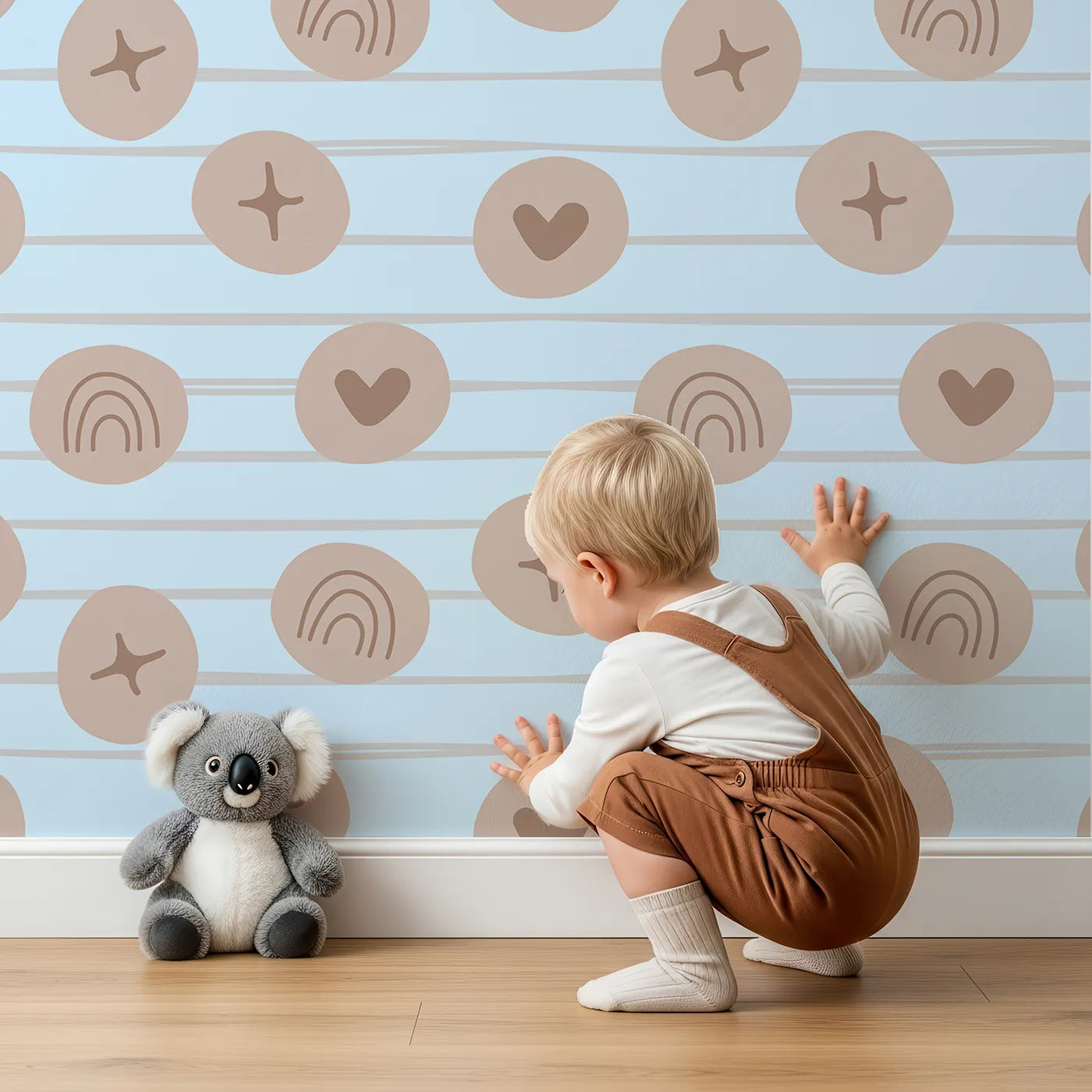 Lovely child standing in front of Whimsy Tots Boho Rhythm Doodle Wallpaper in Sky Blue with rainbow, heart, star, stripe, doodle in design.