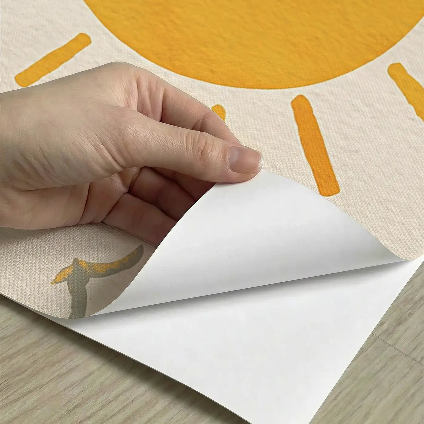 Peel-and-stick detail of Bold Sun Cloud Happy Wainscoting Wallpaper by Whimsy Tots