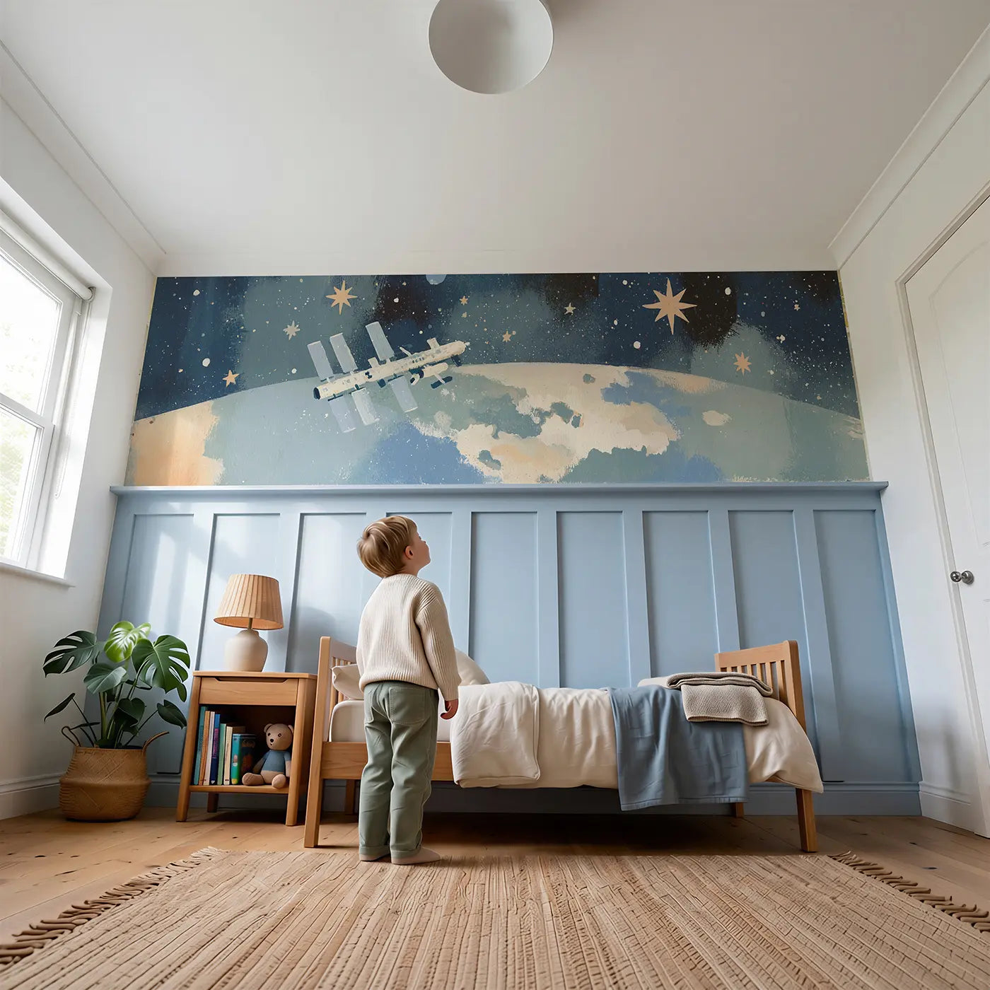 Child reading near Graphic Space Station Bold Wainscoting Wallpaper by Whimsy Tots