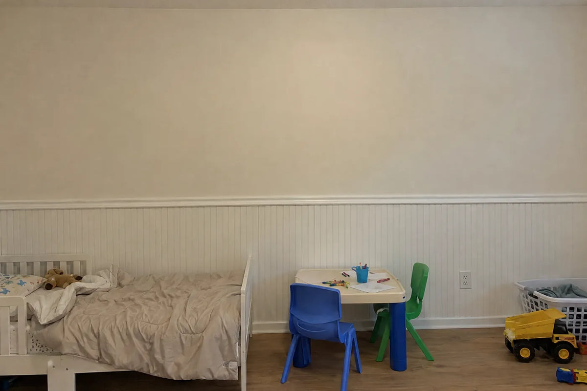 Storybook wainscoting wallpaper of flamingos, a cheetah cub and a parrot, the same room before, by Whimsy Tots