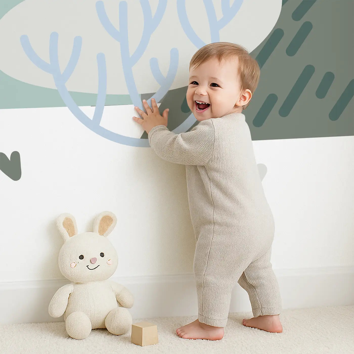 Child in front of Whimsy Tots Whimsical Peaks Wall Mural with mountain, tree, forest, hill in design.