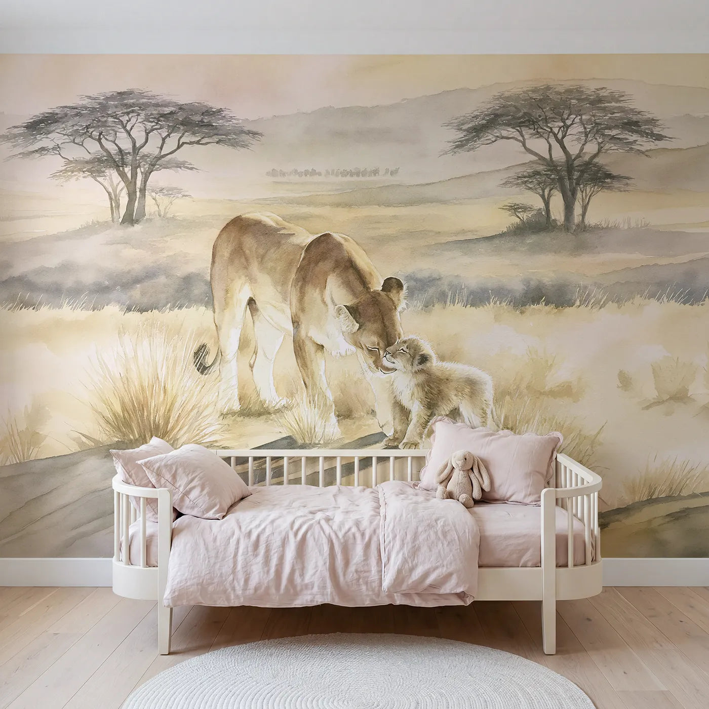 Watercolor wall mural of a lioness nuzzling her cub by Whimsy Tots