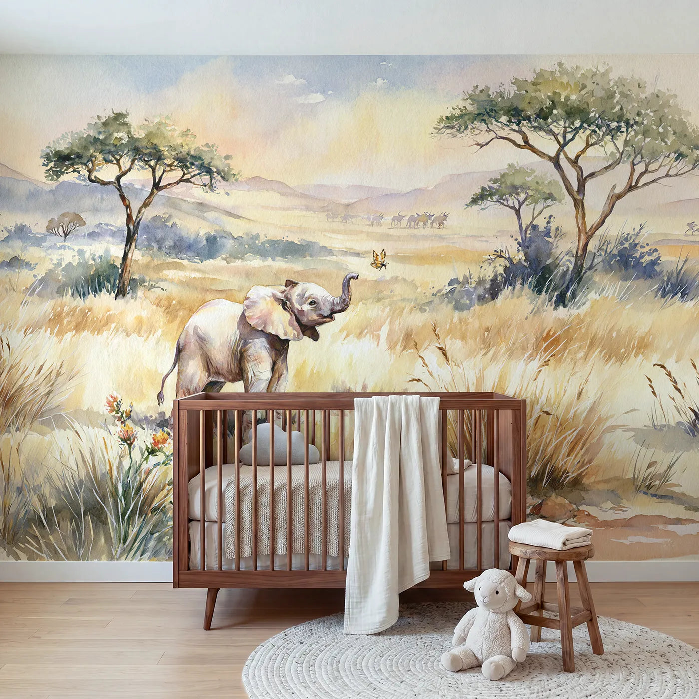 Watercolor wall mural of a baby elephant and butterfly by Whimsy Tots