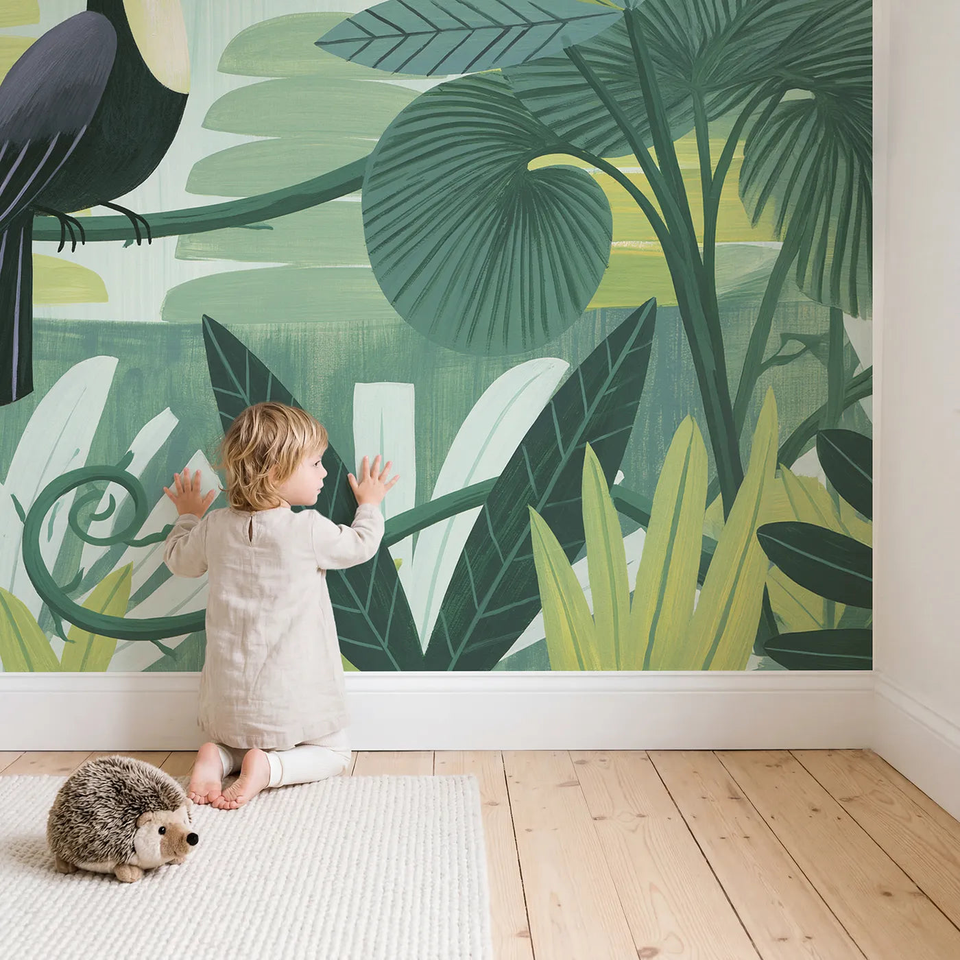 Child in nursery with Folk Toucan Bright Wallpaper Mural by Whimsy Tots