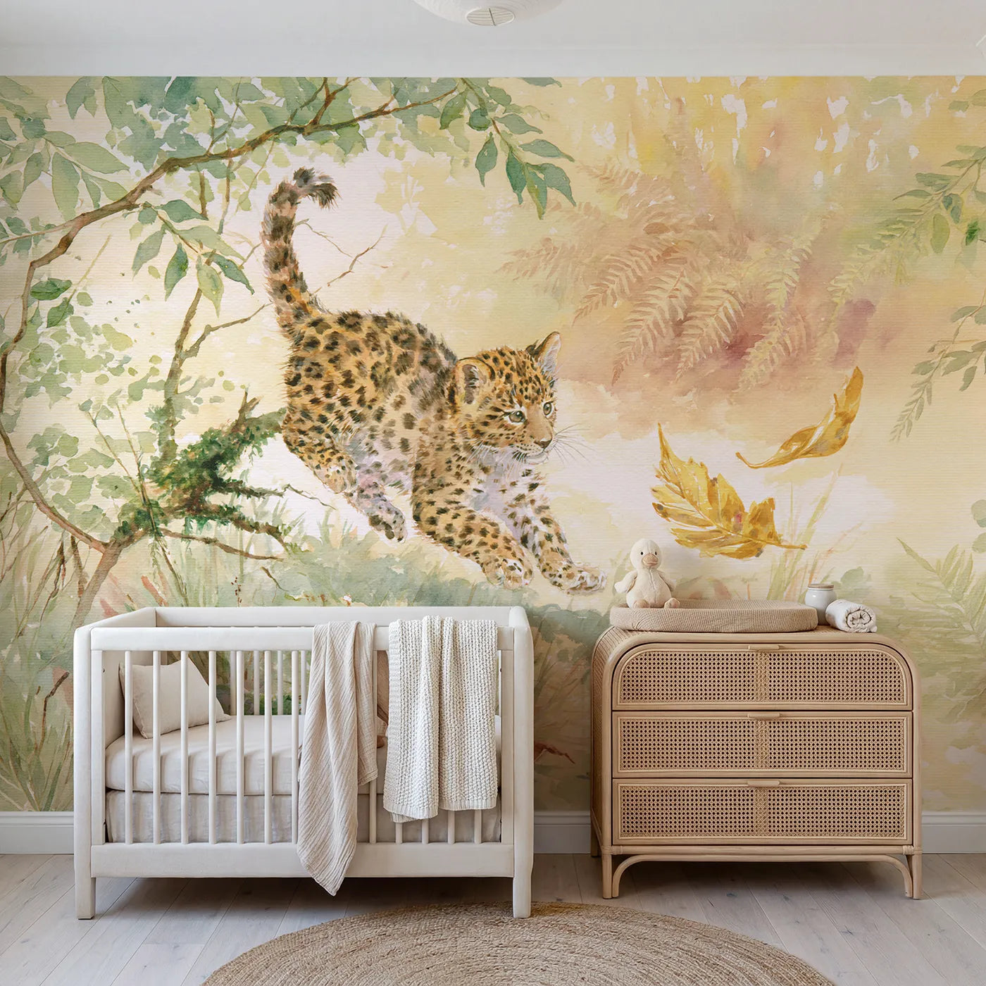 Watercolor leopard cub pouncing at a golden leaf, wall mural for a bedroom by Whimsy Tots