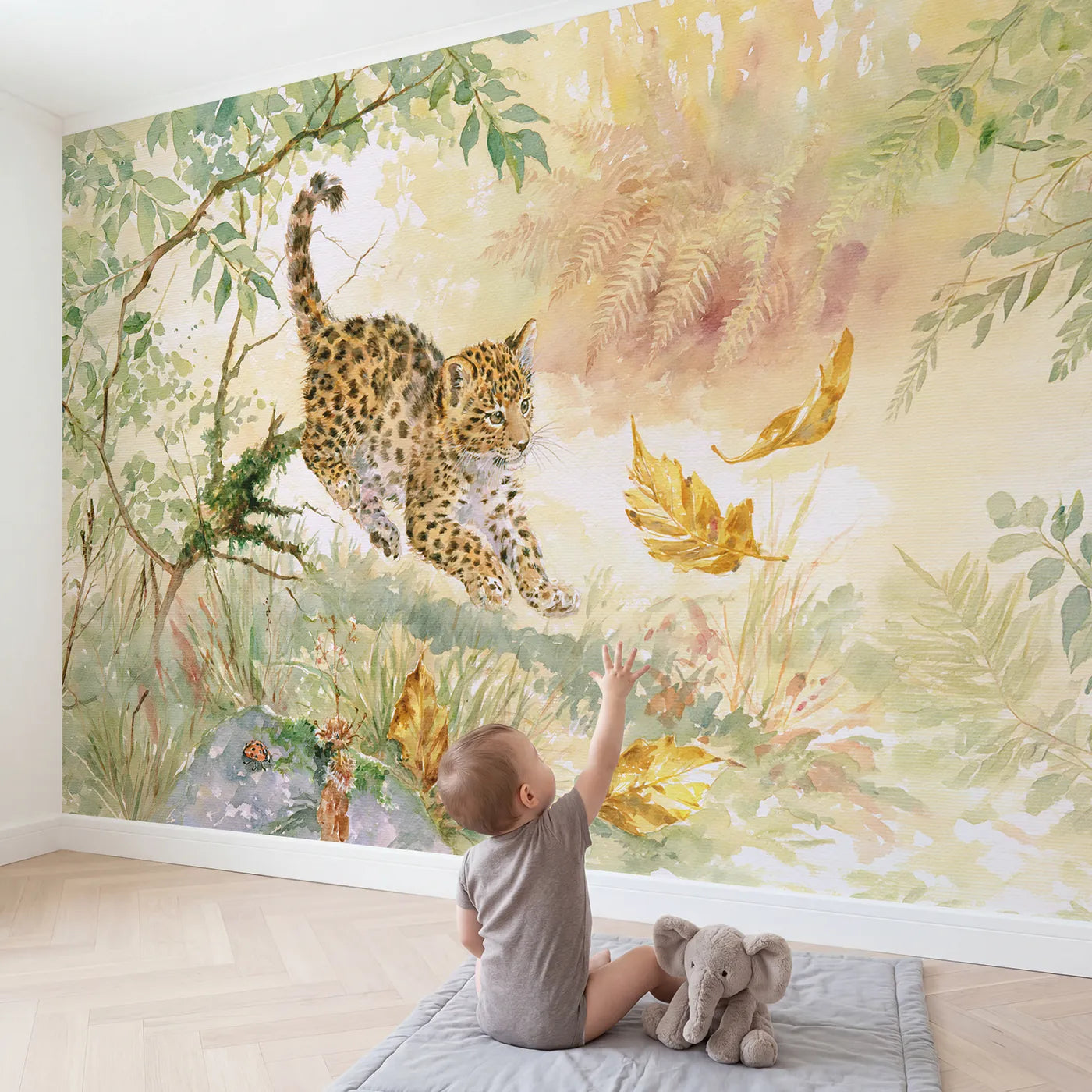 Child in nursery with Leopard Cub Leaf Pounce Wallpaper Mural by Whimsy Tots