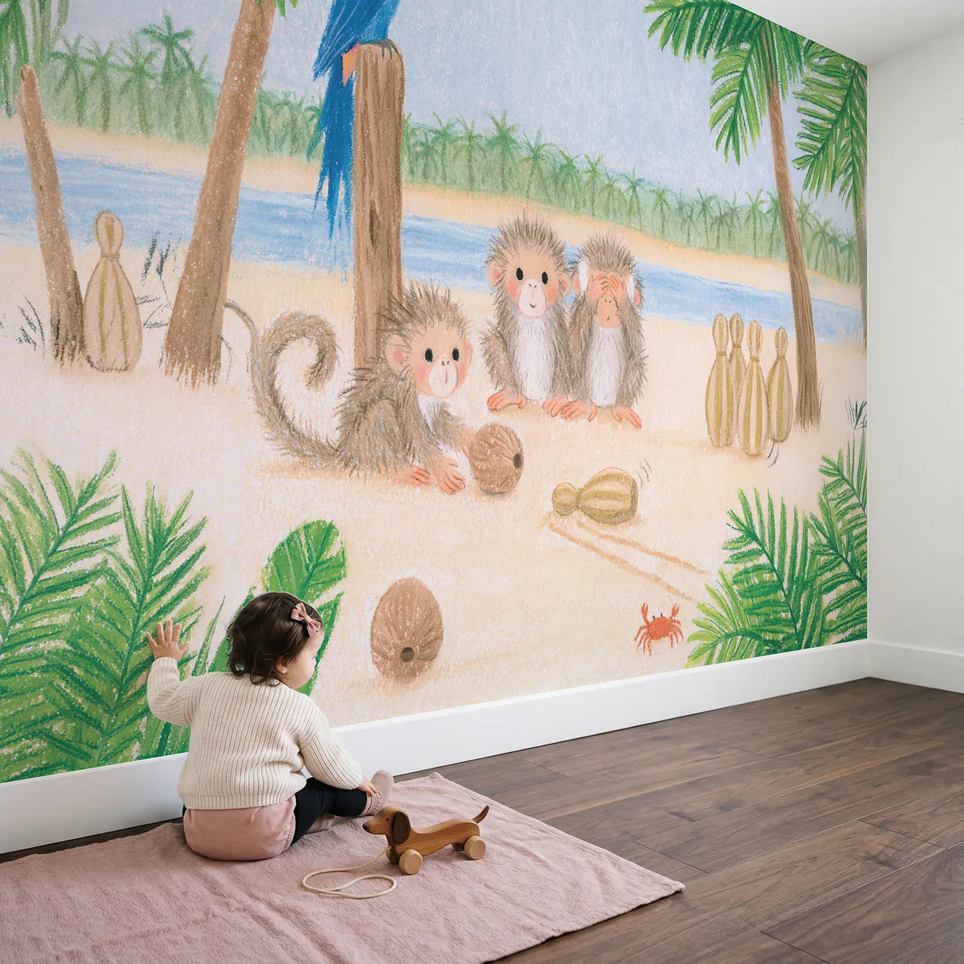 Child in nursery with Monkey Coconut Bowling Wallpaper Mural by Whimsy Tots