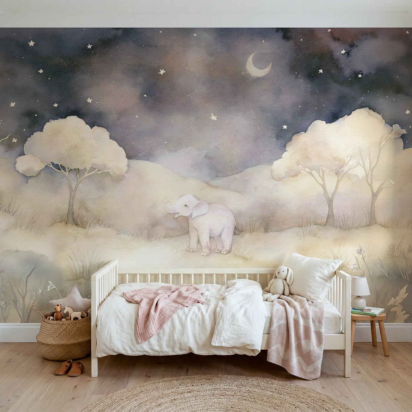Watercolor wall mural of a baby elephant under stars by Whimsy Tots