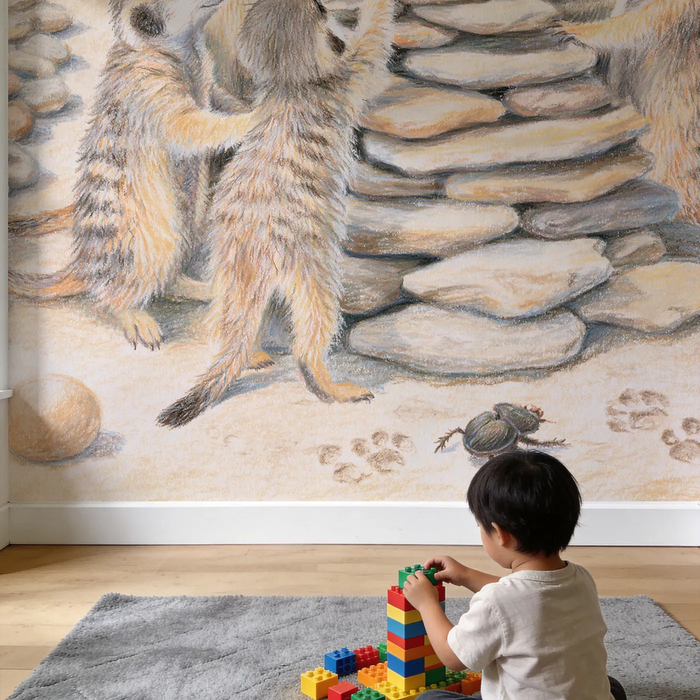 Child in nursery with Meerkat Pebble Tower Wallpaper Mural by Whimsy Tots
