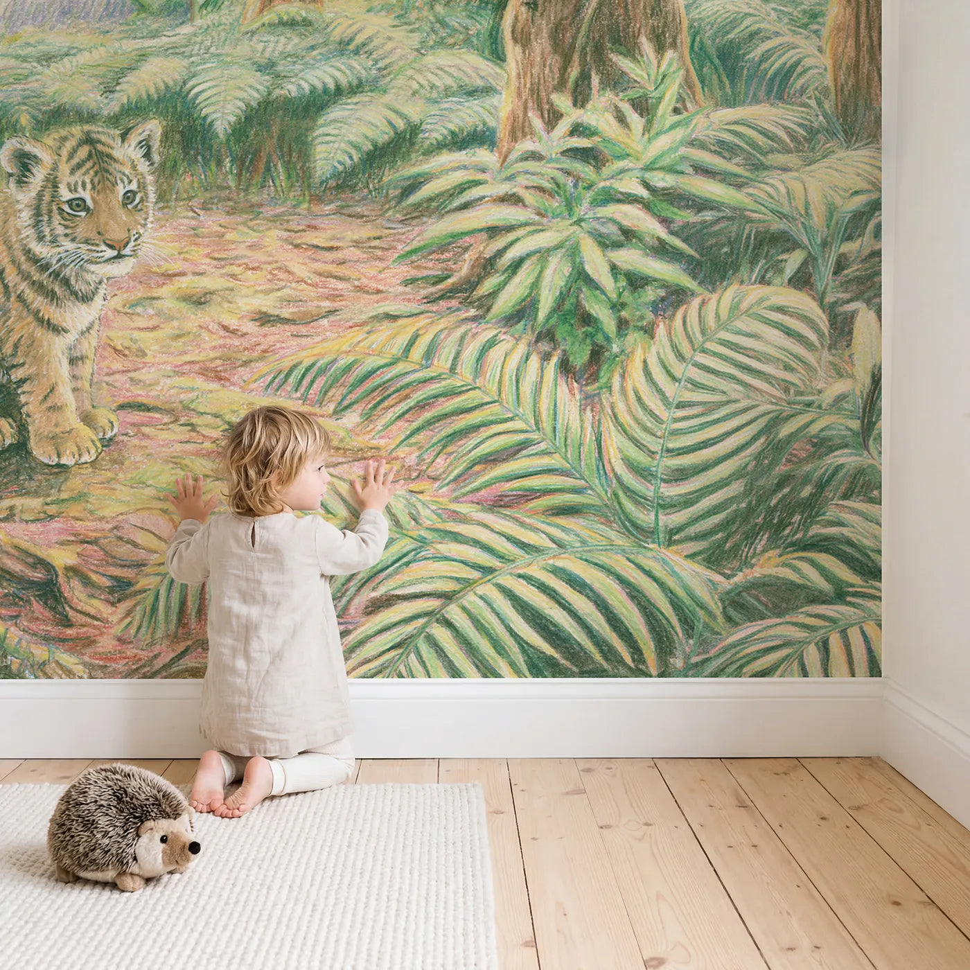 Child in nursery with Curious Tiger Cub Wallpaper Mural by Whimsy Tots