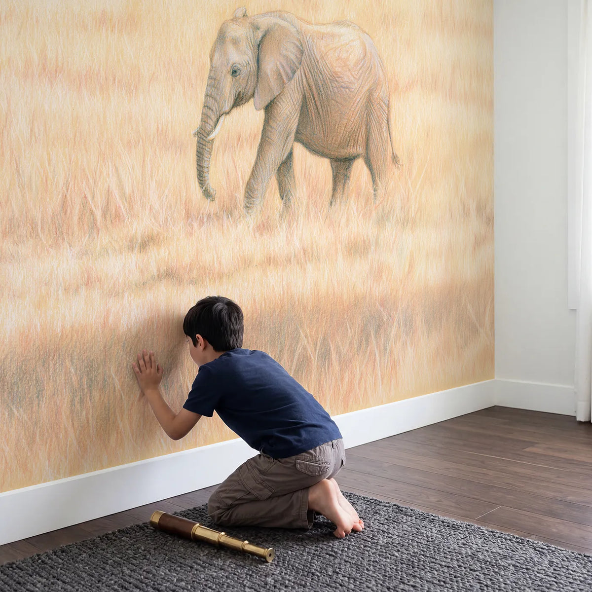 Child in nursery with Gentle Elephant in the Grass Wallpaper Mural by Whimsy Tots