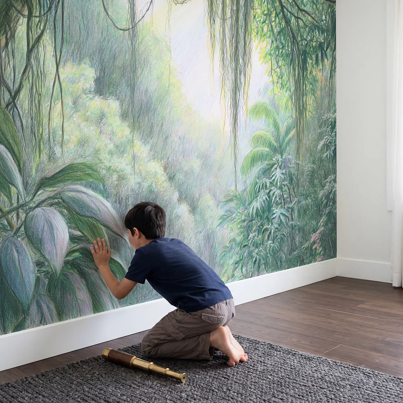 Child in nursery with Lush Jungle Canopy Wallpaper Mural by Whimsy Tots