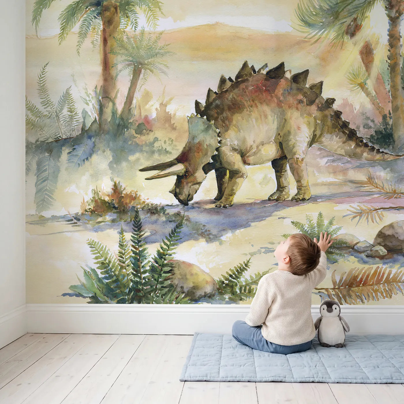 Child in nursery with Stegosaurus Plated Back Wallpaper Mural by Whimsy Tots