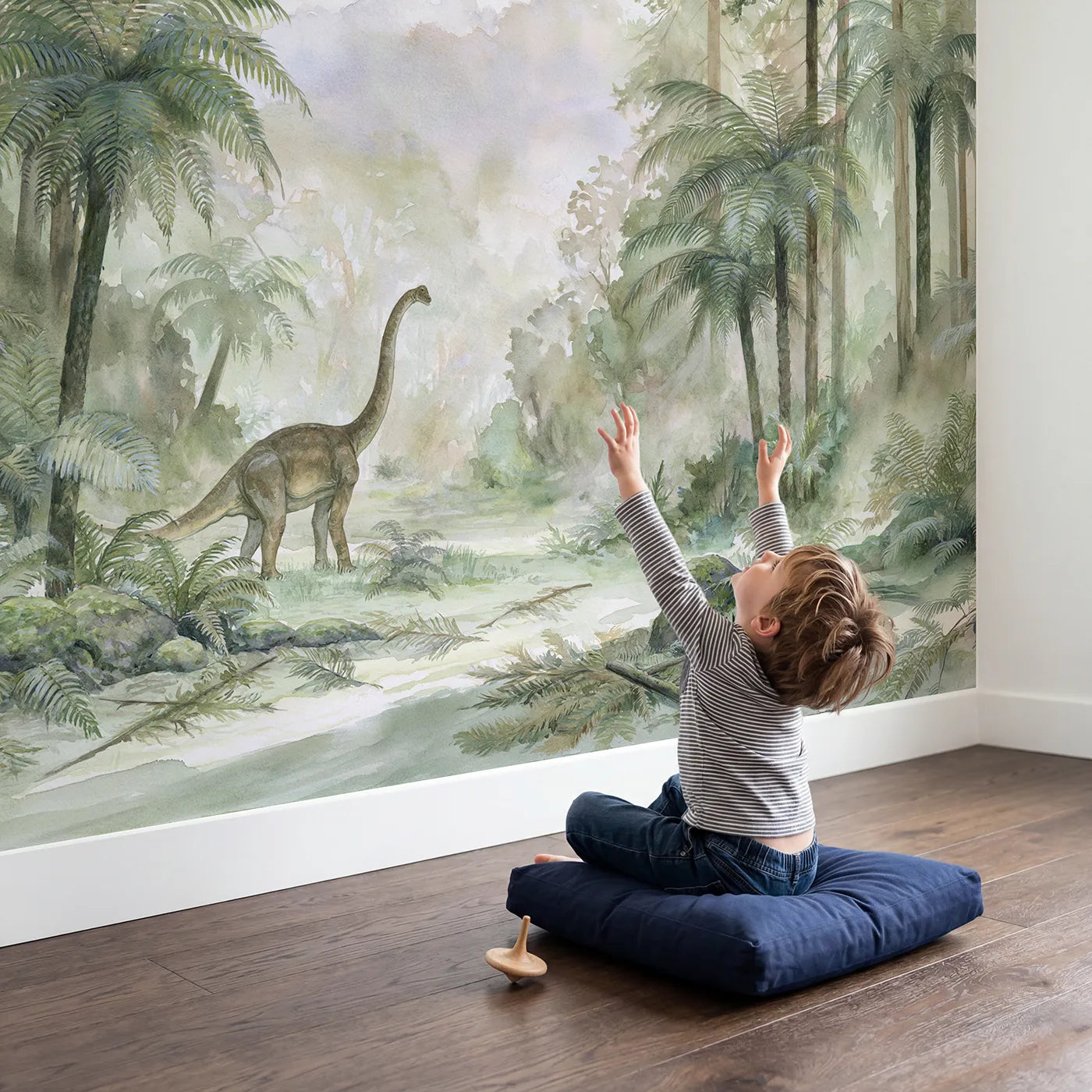 Child in nursery with Brachiosaurus Treetop Reach Wallpaper Mural by Whimsy Tots