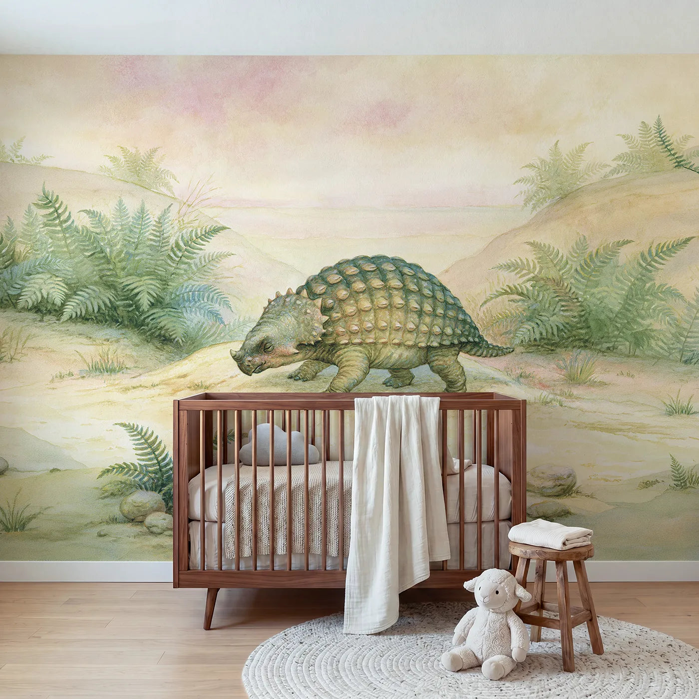 Storybook wall mural of a cozy baby ankylosaurus by Whimsy Tots
