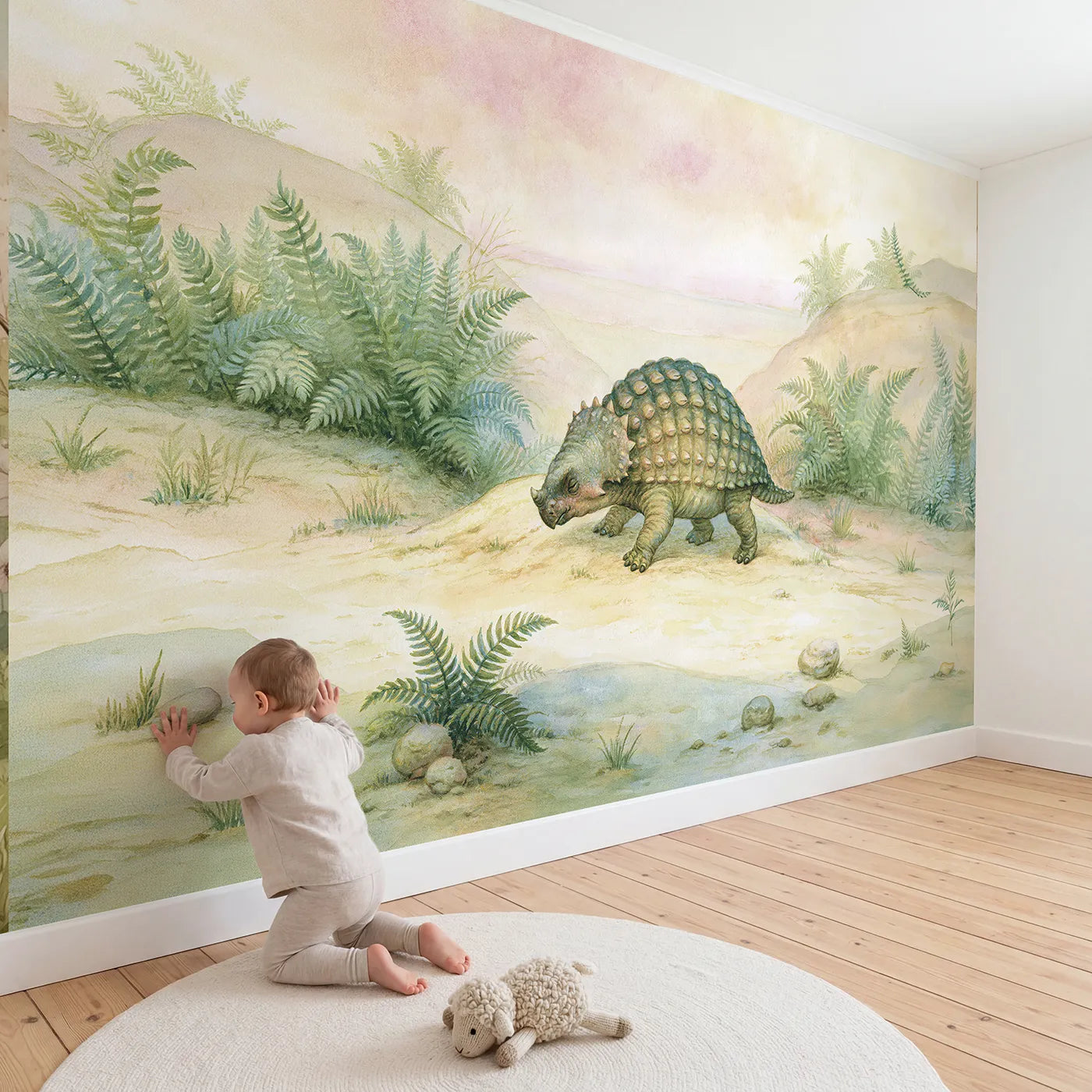 Child in nursery with Ankylosaurus Cosy Plod Wallpaper Mural by Whimsy Tots
