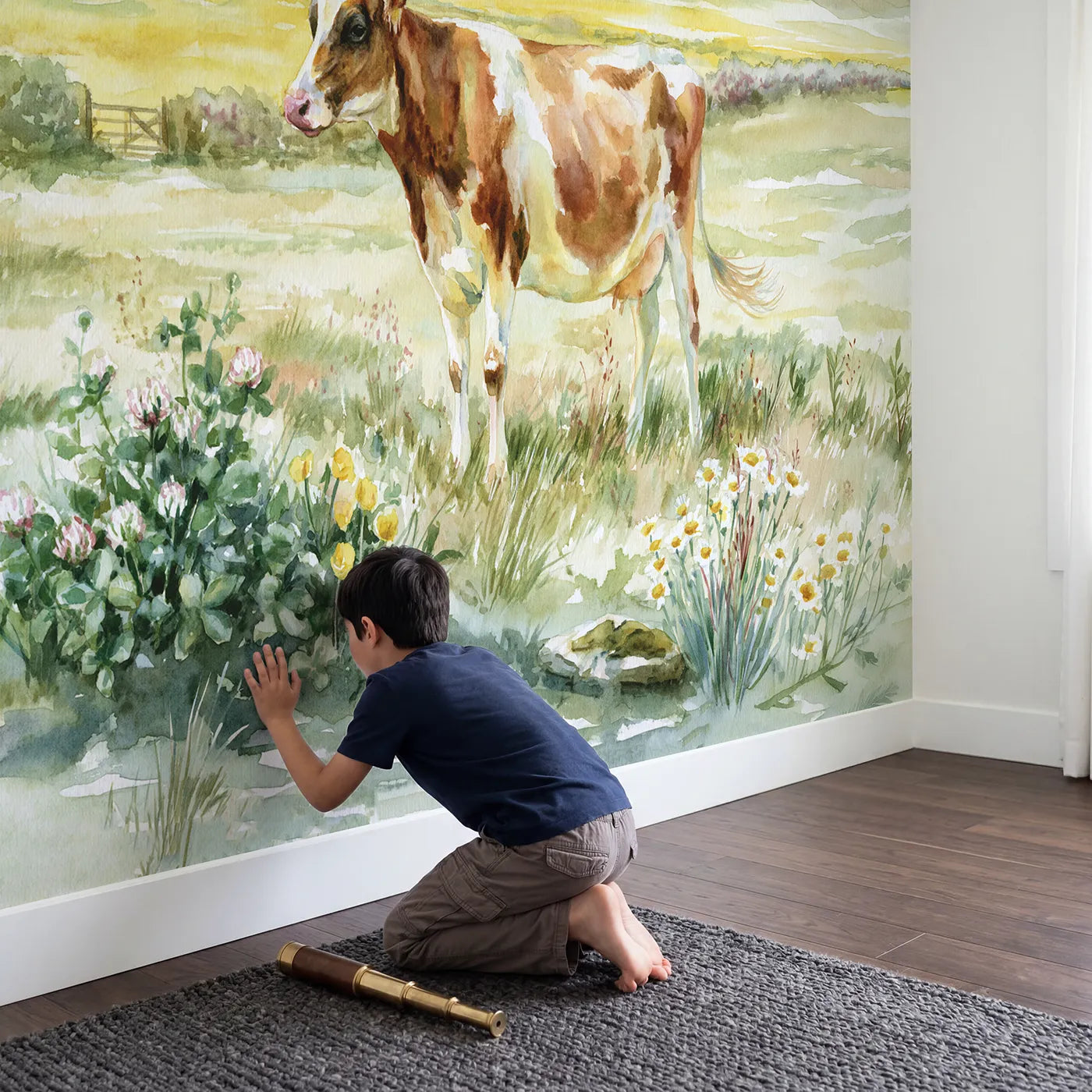 Child in nursery with Gentle Pasture Cow Wallpaper Mural by Whimsy Tots