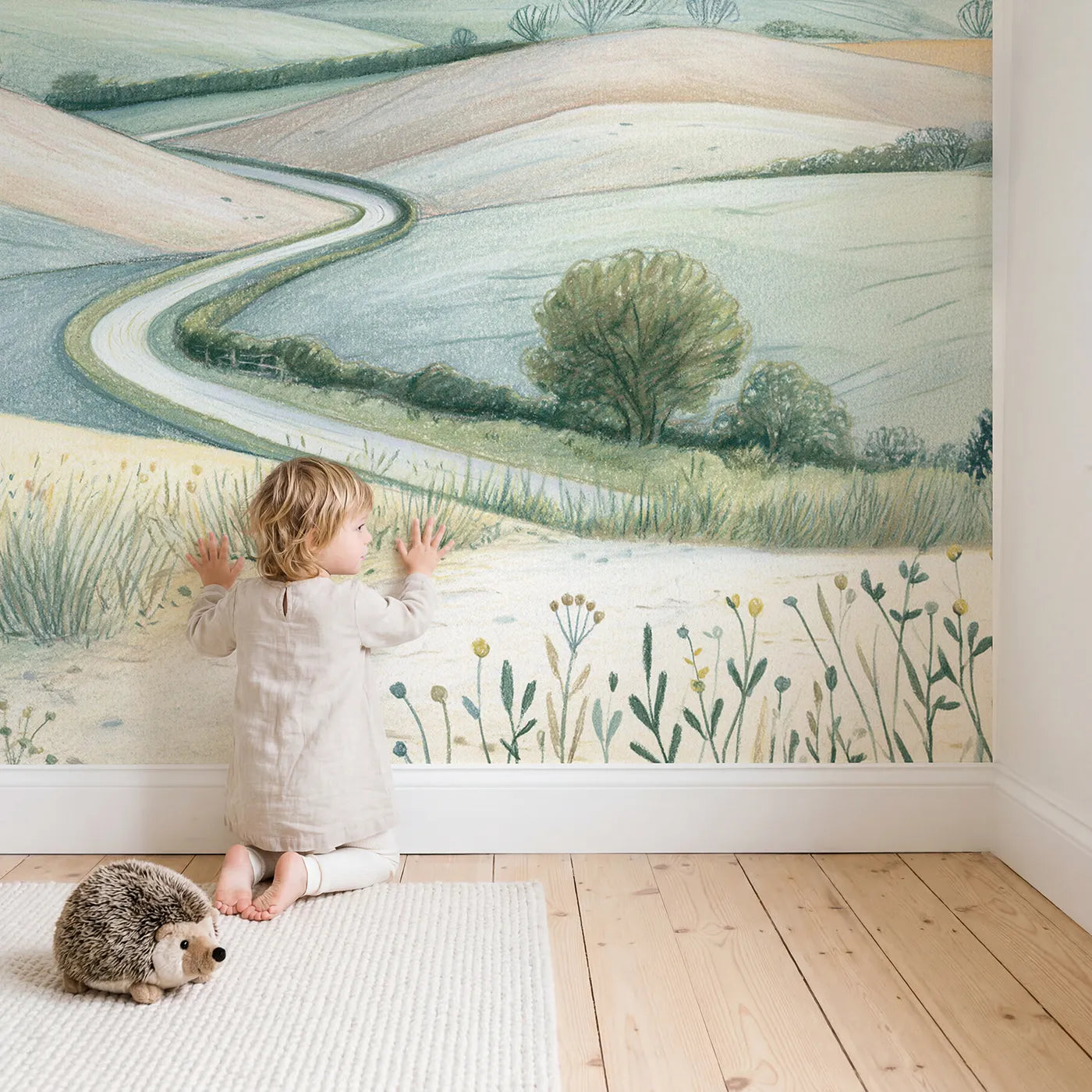 Child in nursery with Gentle Farm Hills Wallpaper Mural by Whimsy Tots