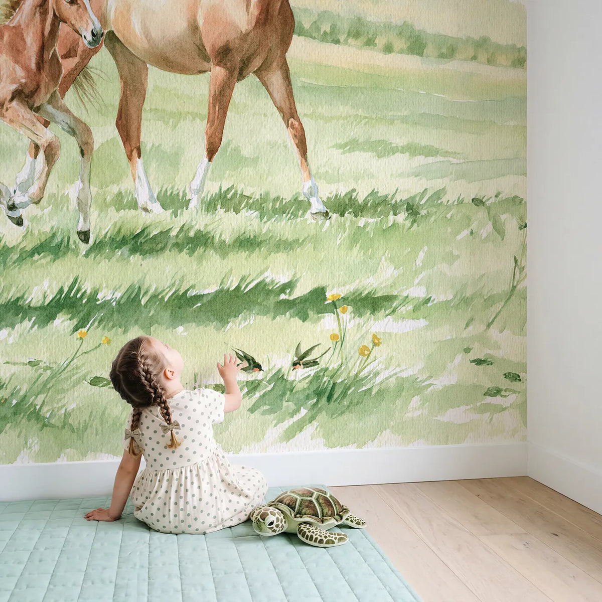 Child in nursery with The First Trot Wallpaper Mural by Whimsy Tots
