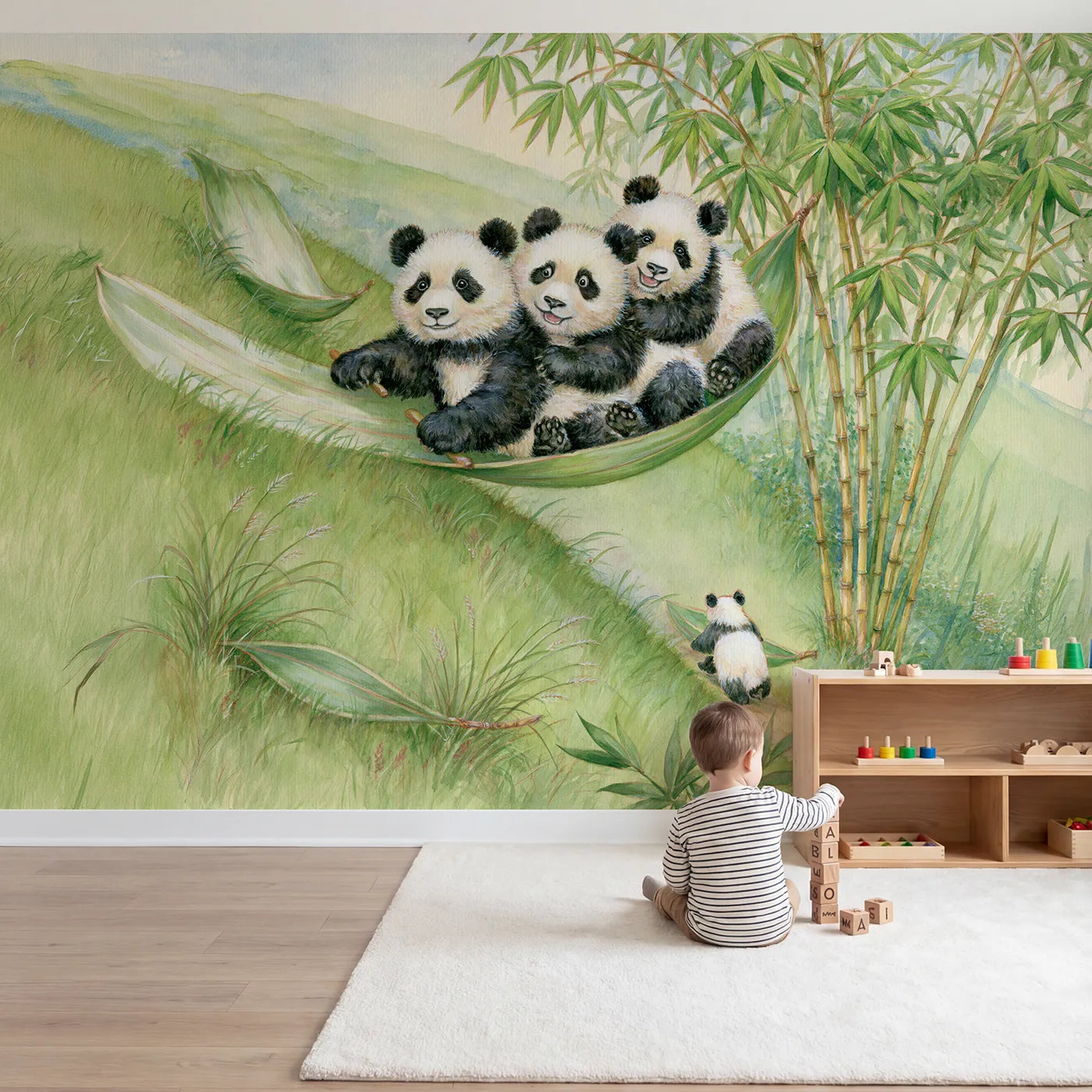 Child in nursery with The Bamboo Leaf Sled Wallpaper Mural by Whimsy Tots