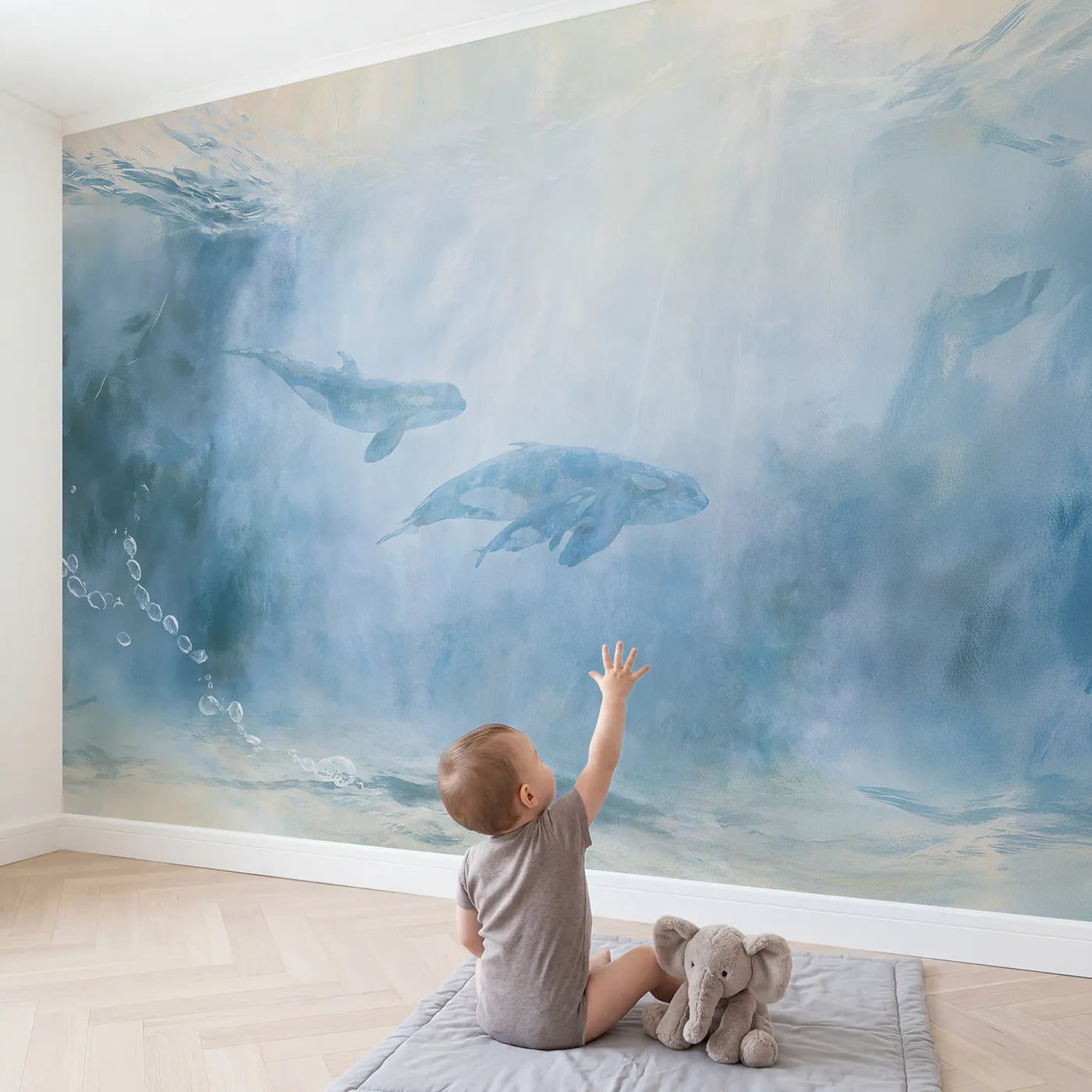 Child in nursery with Whale Calf Lullaby Wallpaper Mural by Whimsy Tots