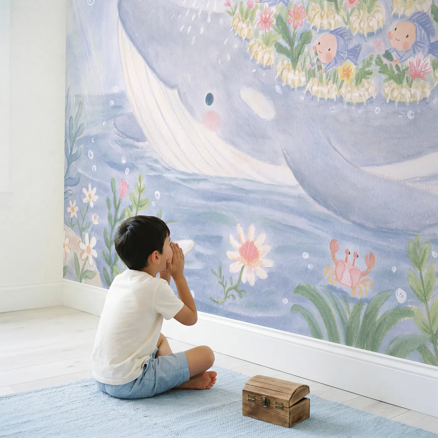 Child in nursery with The Whale's Garden Wallpaper Mural by Whimsy Tots