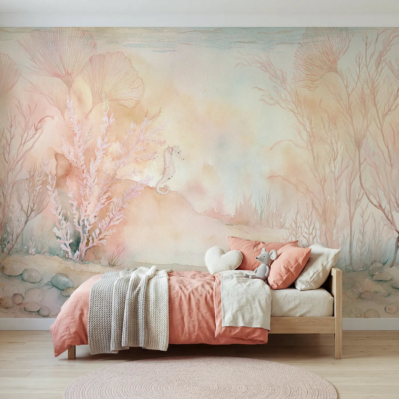 Watercolor wall mural of a seahorse drifting by coral by Whimsy Tots