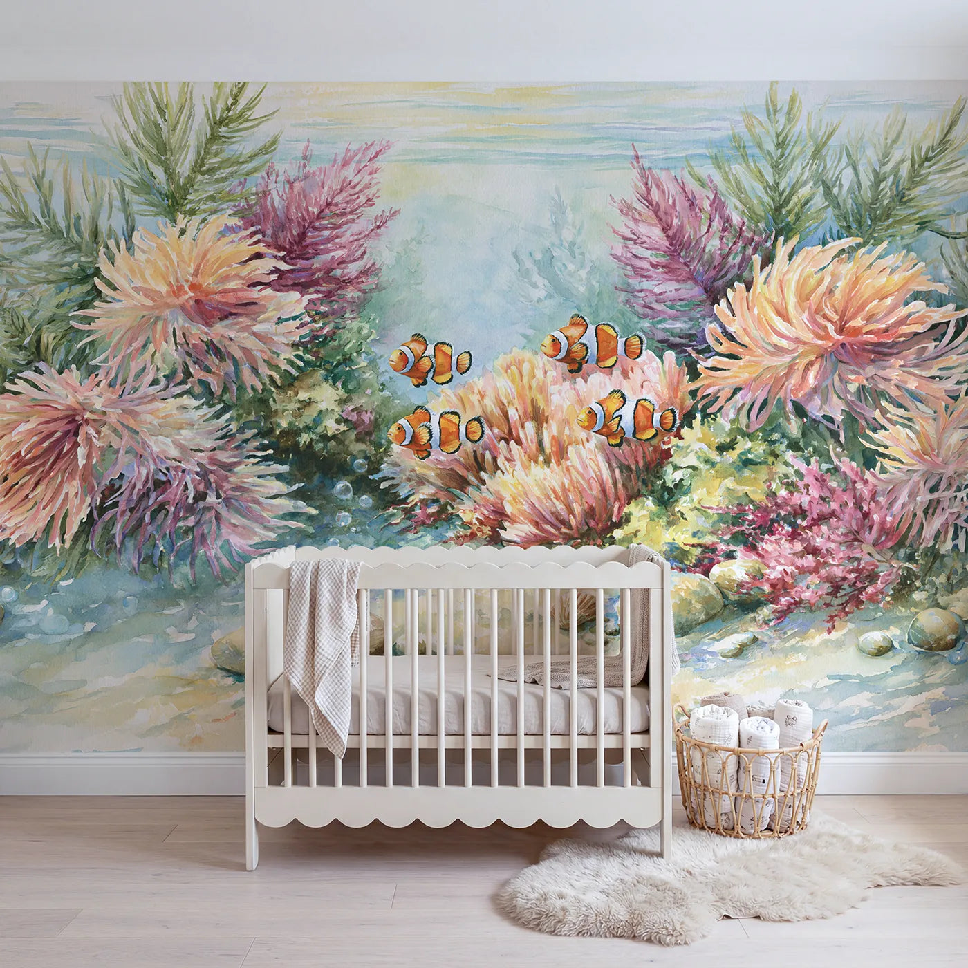 Watercolor wall mural of a clownfish family reef by Whimsy Tots