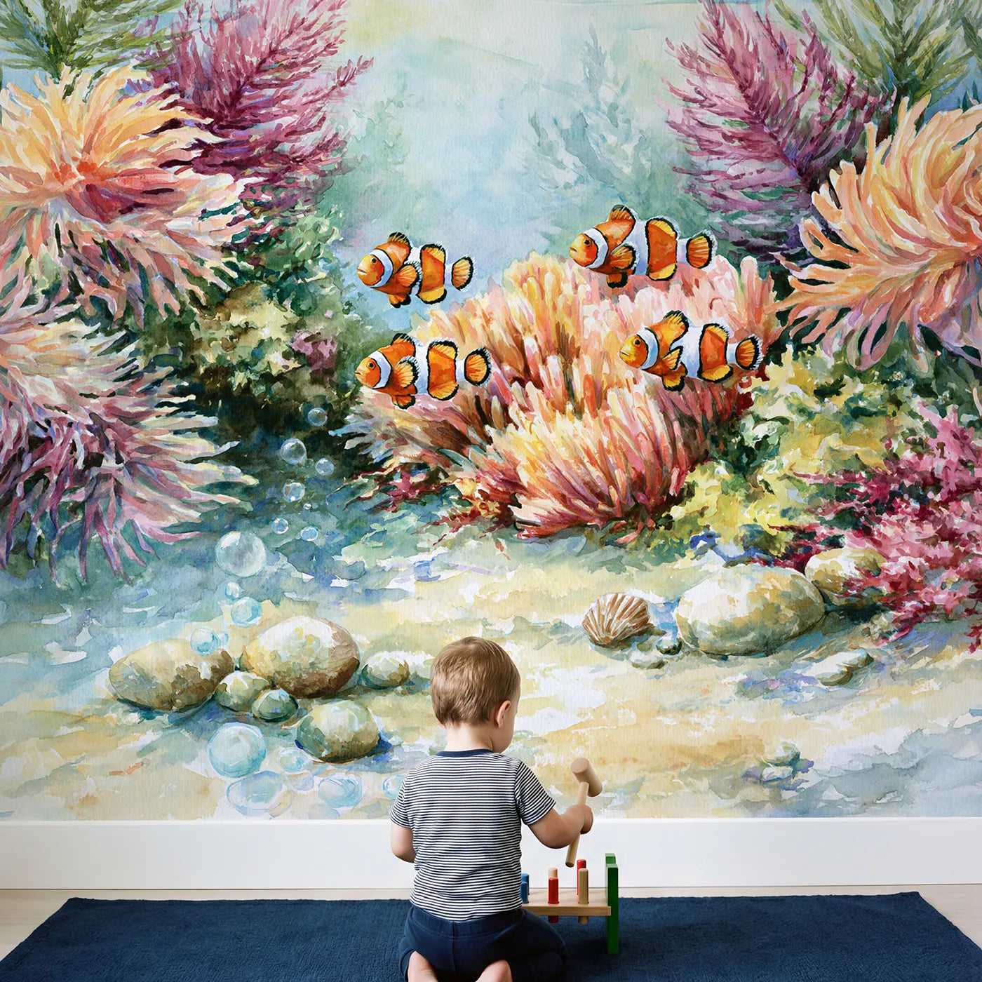Child in nursery with Clownfish Family Reef Wallpaper Mural by Whimsy Tots