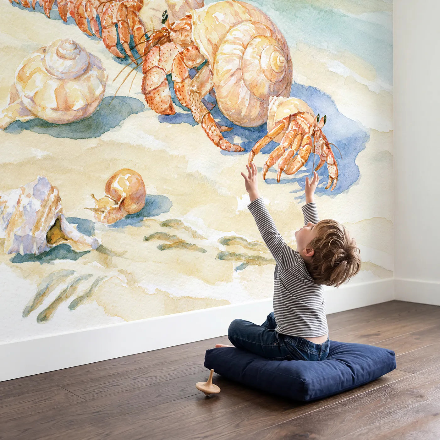 Child in nursery with The Hermit Crab Shell Swap Wallpaper Mural by Whimsy Tots