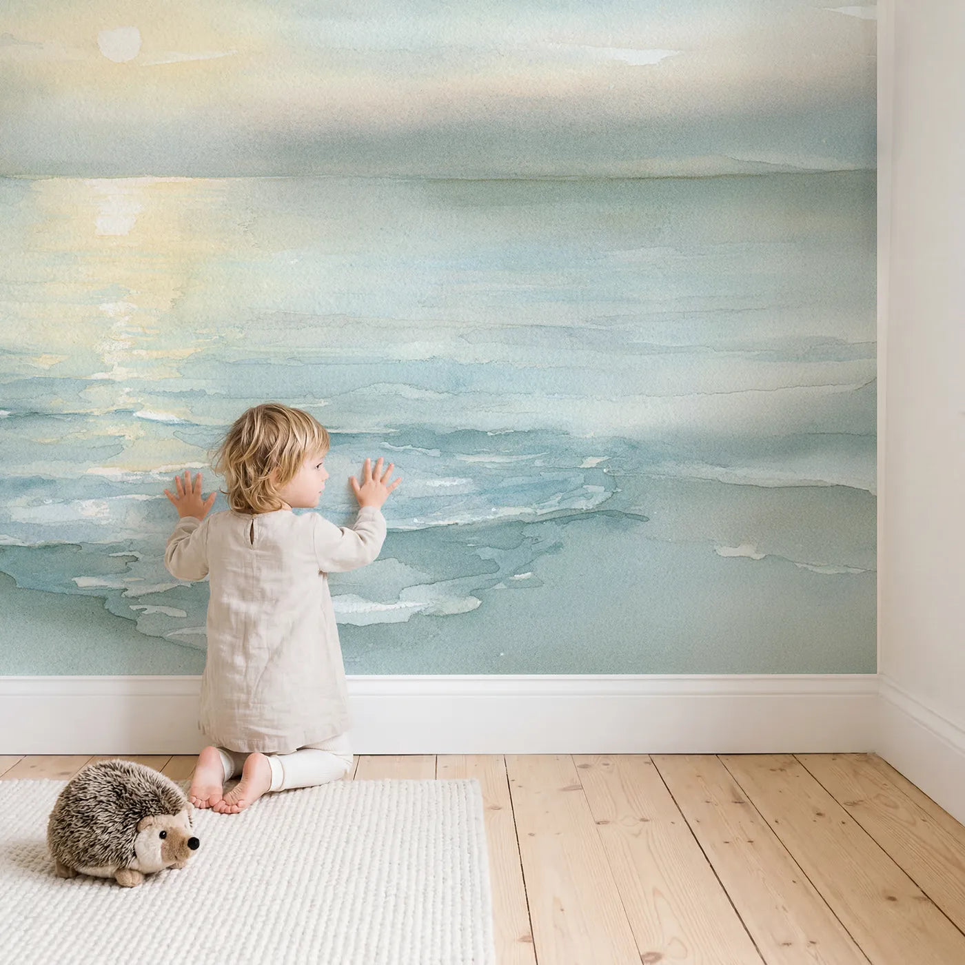 Child in nursery with Moonlit Ocean Lull Wallpaper Mural by Whimsy Tots