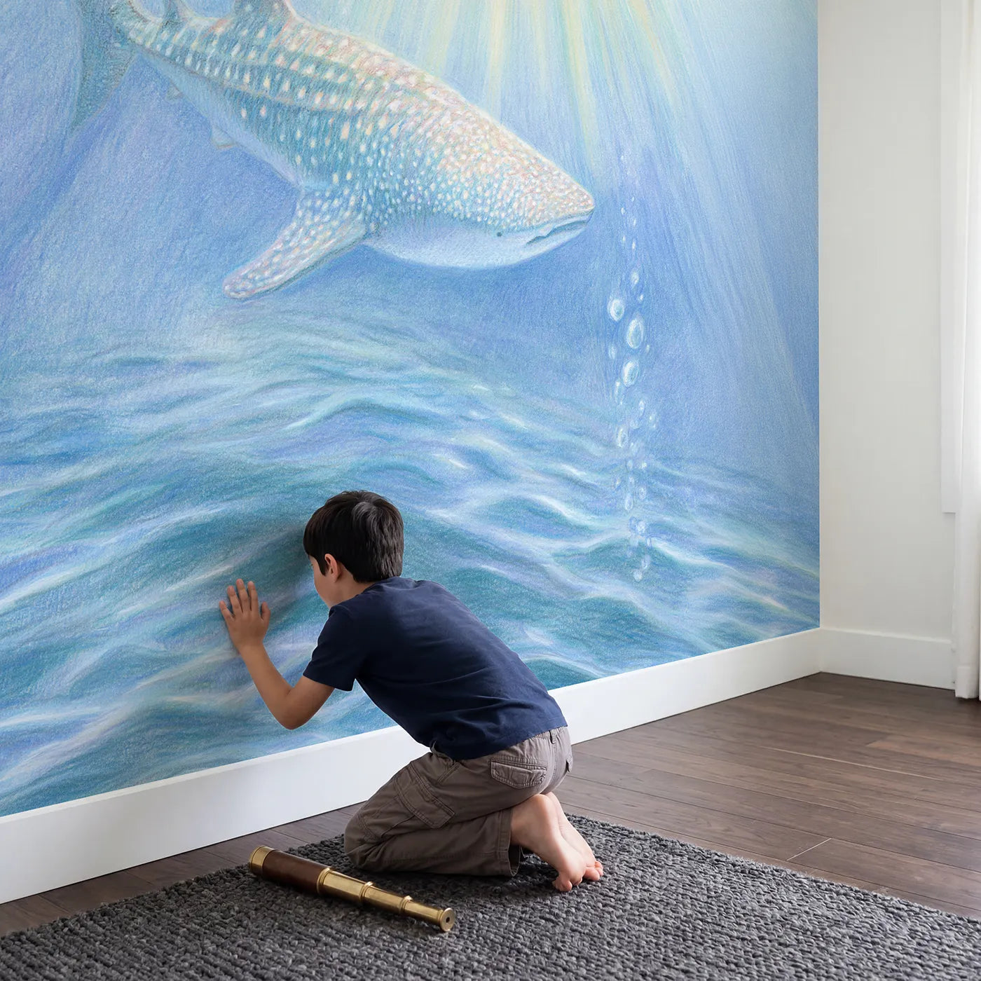 Child in nursery with Gentle Whale Shark Wallpaper Mural by Whimsy Tots