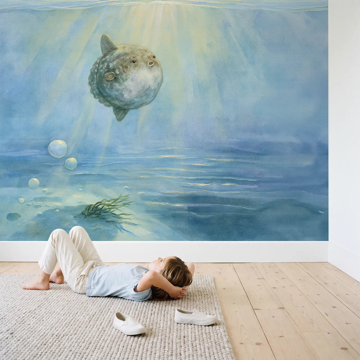 Child in nursery with Gentle Sunfish Wallpaper Mural by Whimsy Tots