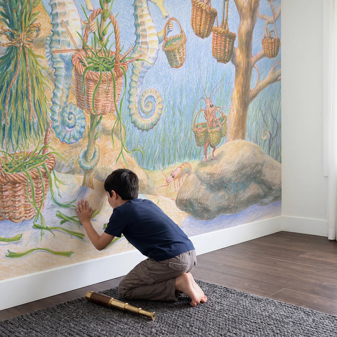 Child in nursery with The Seagrass Basket Weavers Wallpaper Mural by Whimsy Tots