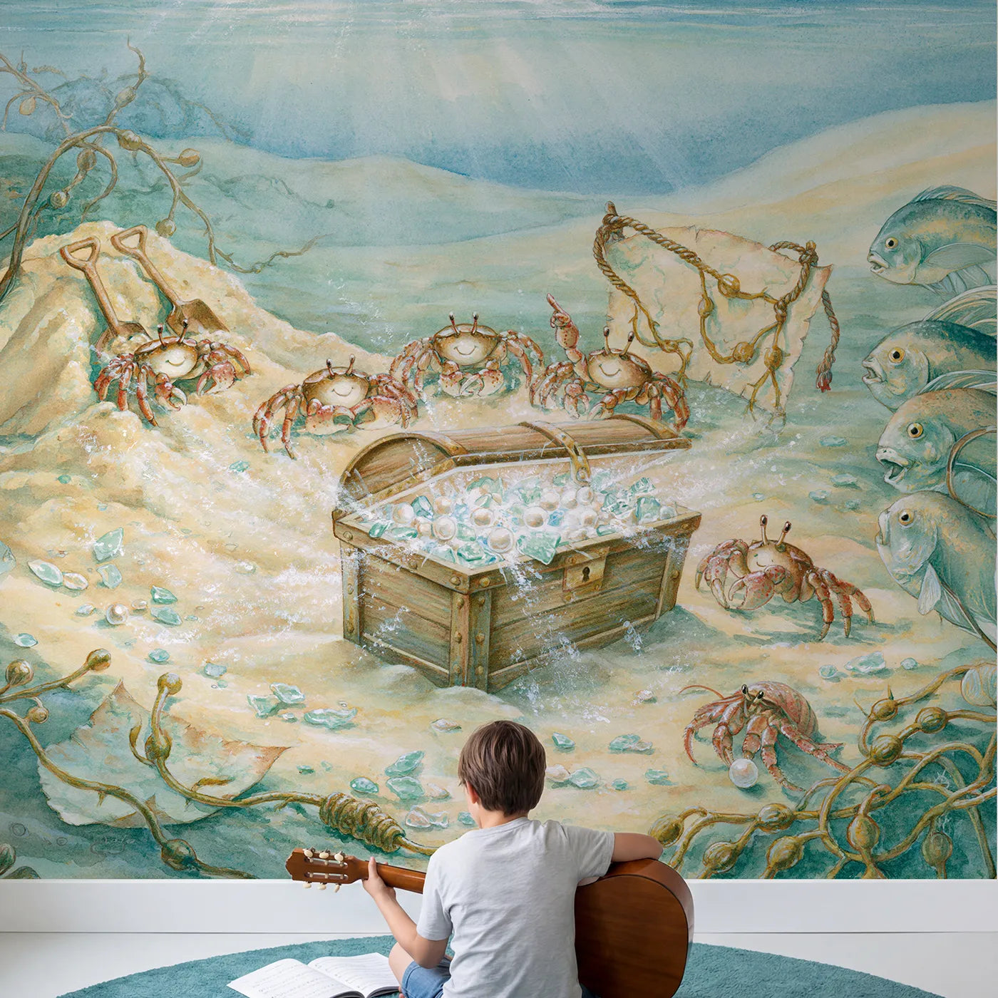 Child in nursery with The Buried Treasure Dig Wallpaper Mural by Whimsy Tots