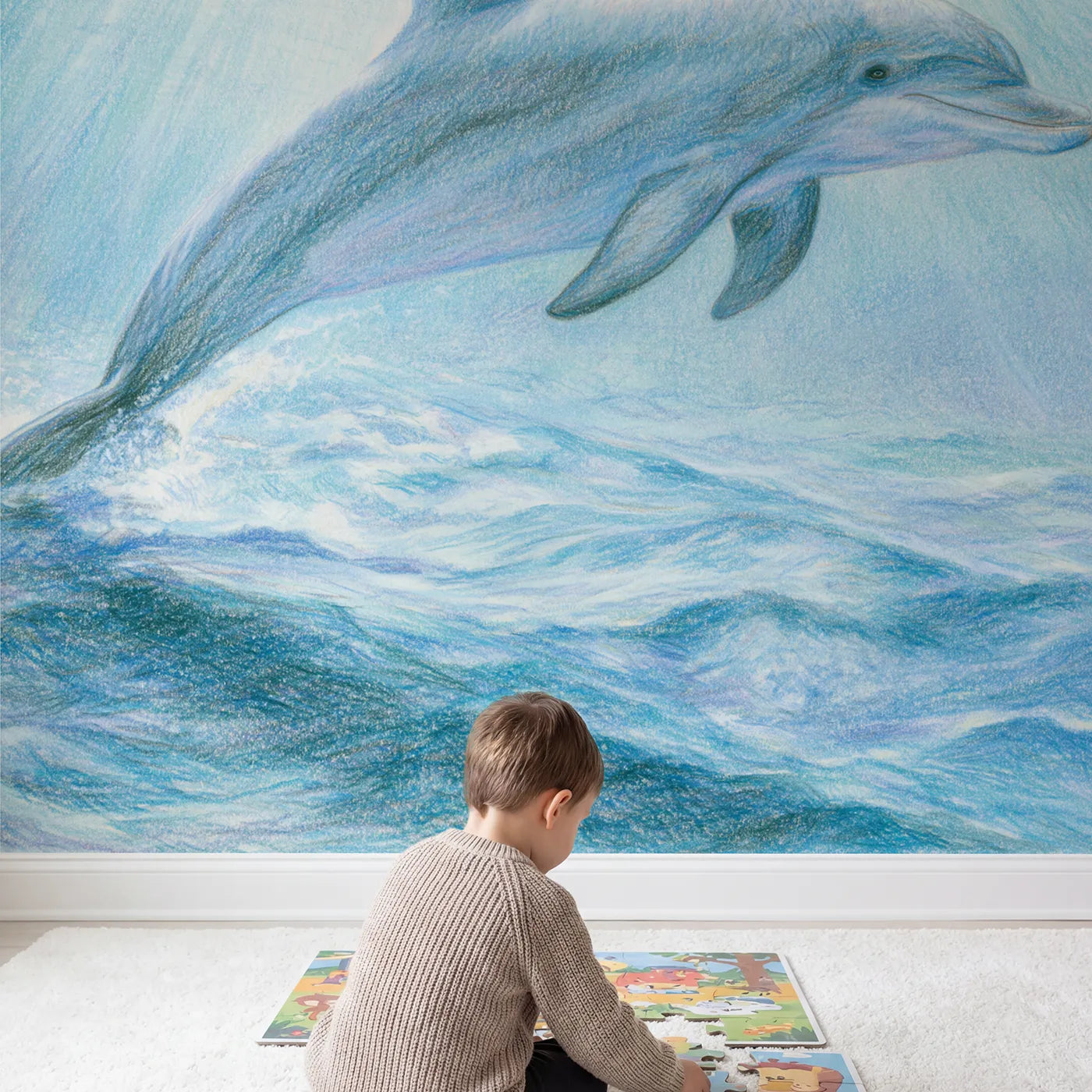 Child in nursery with Gentle Dolphin Wallpaper Mural by Whimsy Tots