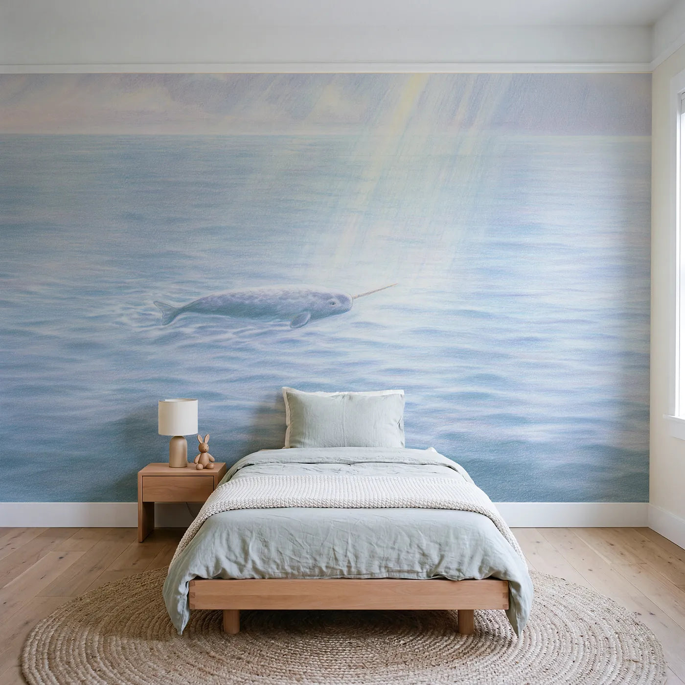 Colored-pencil wall mural of a small narwhal calf by Whimsy Tots