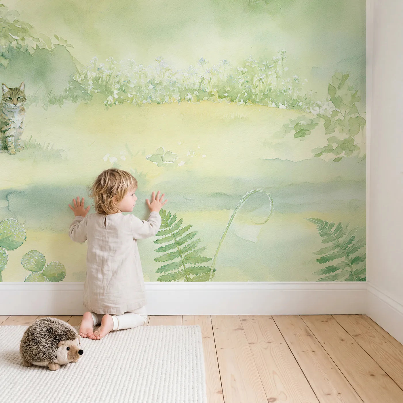 Child in nursery with Misty Cat Garden Wallpaper Mural by Whimsy Tots
