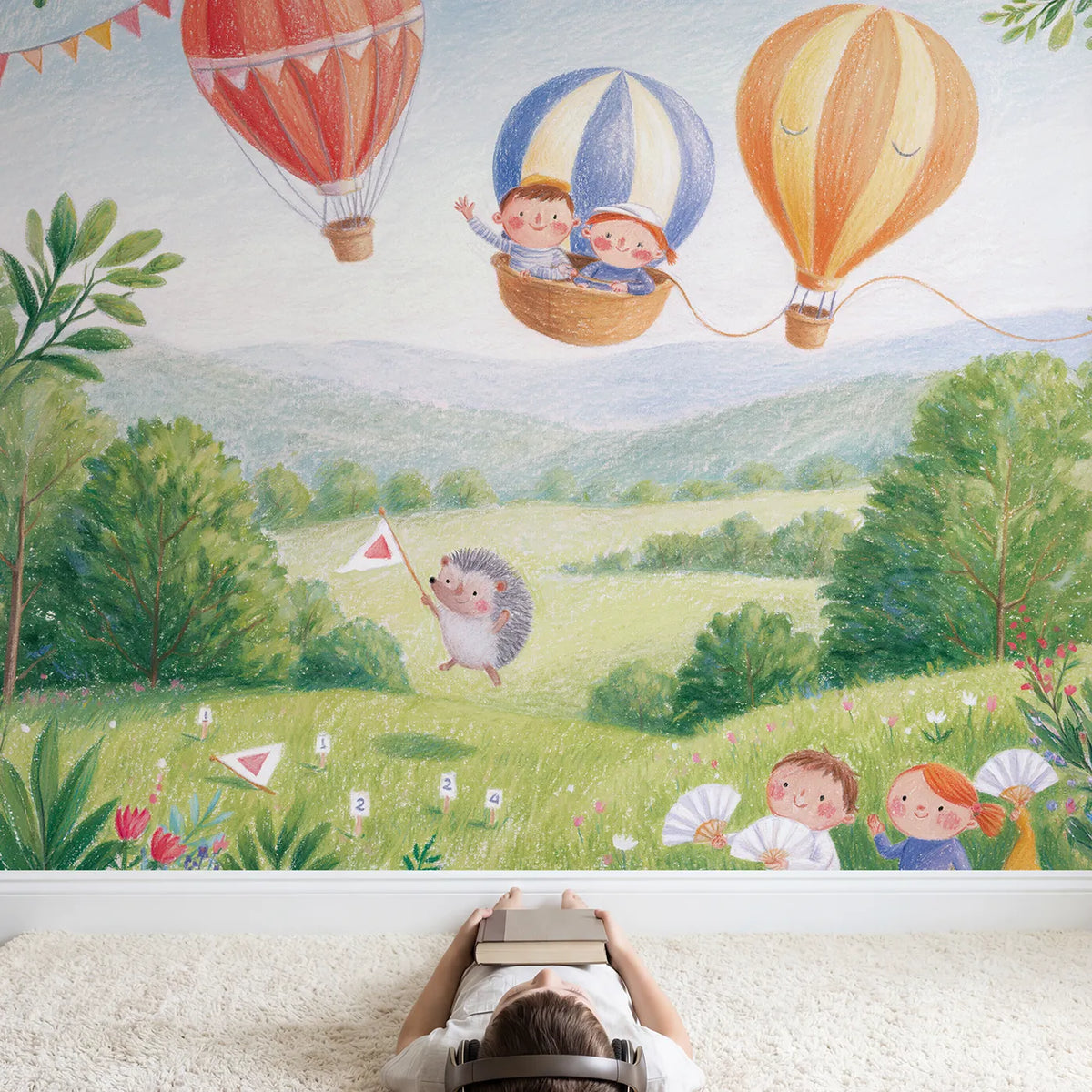 Child in nursery with The Great Balloon Race Wallpaper Mural by Whimsy Tots
