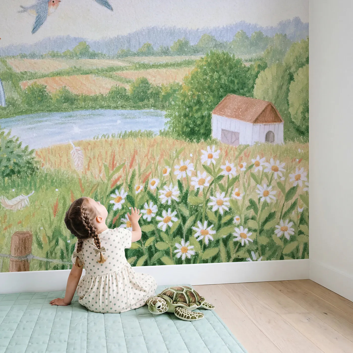 Child in nursery with The Swallow Flight School Wallpaper Mural by Whimsy Tots