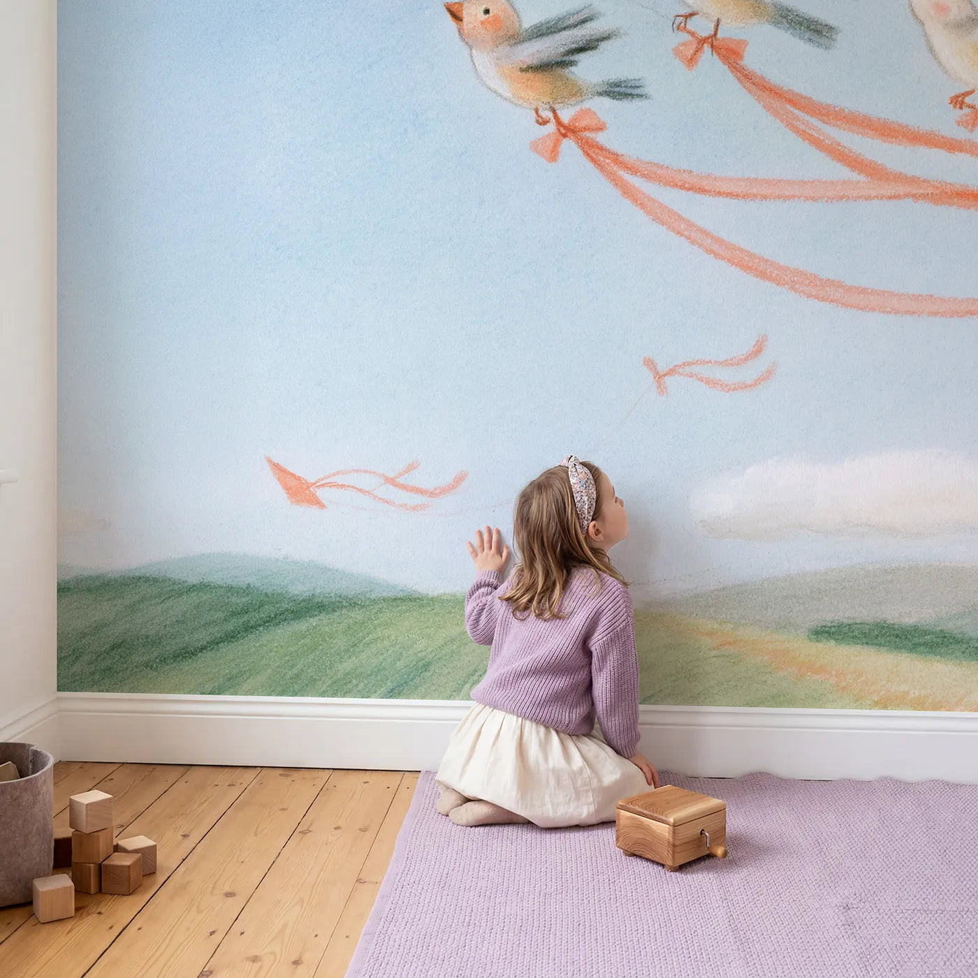 Child in nursery with Riding the Kite Tails Wallpaper Mural by Whimsy Tots