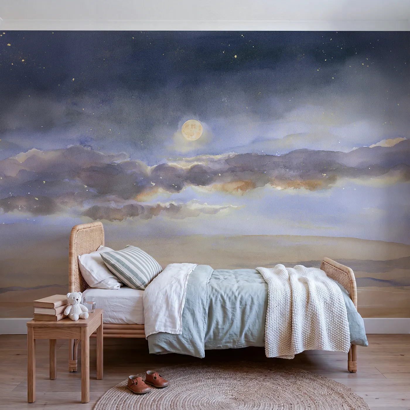 Watercolor wall mural of a moon behind soft clouds by Whimsy Tots