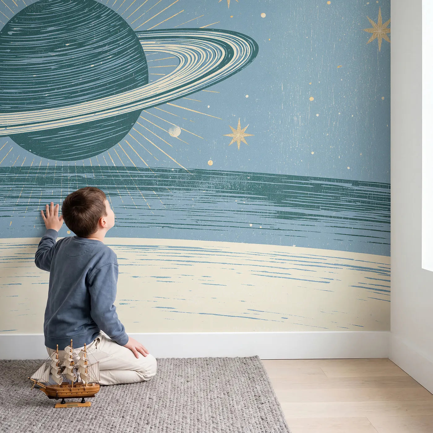 Child in nursery with Linocut Planet Orbit Wallpaper Mural by Whimsy Tots
